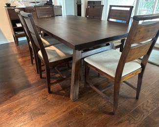 Six chairs tuck in completely on sides measures 40 x 73” without additional draw leaf ends that add 13.5 inches each