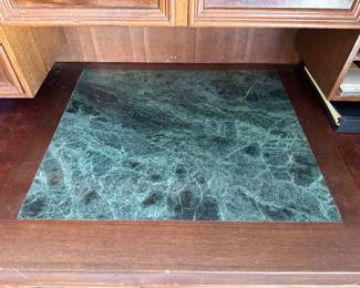 Green marble insert in roll top desk