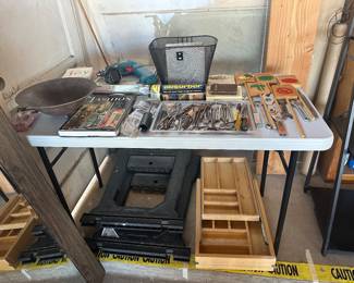 Drawer with sliding levels for kitchen utensils, saw horses, drill, small tools
