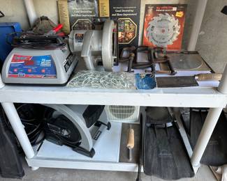 Duralast battery charger, Skil circular saw, Lasko blower power station, fins, saw blades 