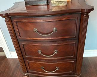 Three drawer bow front nightstand matches dresser leather top is 23 inches wide