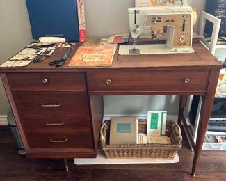 Sewing cabinet machine folds in top and closes up nicely