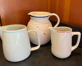 442 trioofmixedceramicpitchersandcream