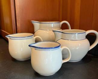 438 fourceramicpitchersincludingpairof