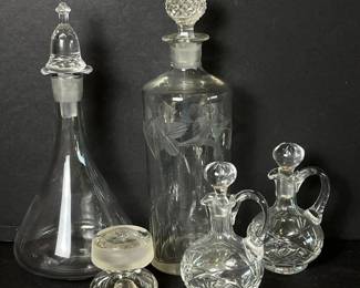 211 assortedofcutglasscruetswithstoppe