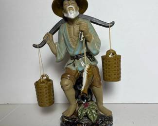 076 ceramicfigurineoffishermancarryingb
