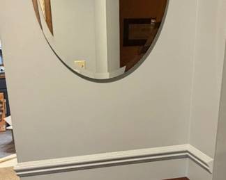 Oval mirror and half circle table