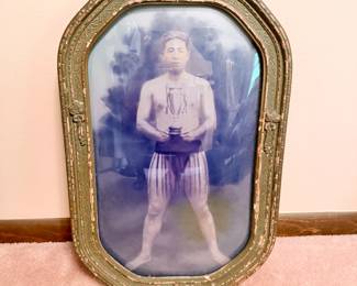 Photo of Japanese wrestler (sumo) early 1900s with trophy