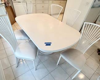 Oval white post modern pedestal Table 66”long x 42”w x 29”h $150: Stoneville, post modern white metal cushioned seat chairs 18w x 18”d x 18.5”floor to seat $65ea