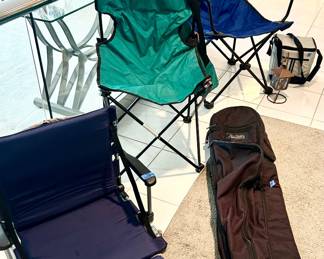 Outdoor folding chairs, golf bag $20, blue chair $10, green chair $7, front armed stadium seat folding chair $15