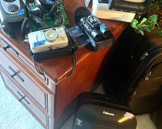 Large Bushnell Binoculars $25, small $15; GPX AM/FM Walkman $15, Minolta Freedom Xoom150 camera $50, Fellows shredder $35, Craig 5” 1980 Black & White TV/ AM/FM Radio w/ case $75