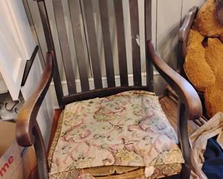 Carved rocker with face in it...straw in cushion