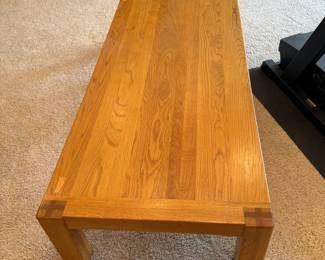 hh- This elegant solid wooden coffee table features a warm natural wood finish that beautifully showcases the grain patterns. Measuring 15.5 inches tall, 71 inches long, and 30 inches wide, it offers ample surface space for your living room essentials. Crafted with sturdy construction and clean lines, this coffee table combines functionality with timeless design. Its durable wood material ensures long-lasting use, making it a perfect centerpiece for any home.