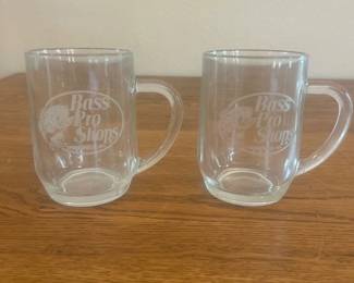 kg- This set includes two clear glass mugs featuring the Bass Pro Shops logo etched on the front. Each mug measures approximately 3.5 inches in height and 3.25 inches in diameter. Crafted from transparent glass, these mugs are perfect for enjoying your favorite hot or cold beverages while showcasing your outdoor and fishing enthusiasm.
