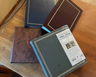 ma- This collection features four photo albums, each with a unique cover design perfect for preserving your memories. Included are albums in deep navy blue, rich burgundy, a marbled brown, and a green album with a classic gold-bordered cover that comfortably holds up to 500 photos with 100 pages inside. Crafted from durable materials, these albums combine vintage charm with practical functionality and a variety of sophisticated colors and finishes to suit any photo storage need. Blue: L: 12in W: 10.7in H: 2.5in Red: L: 13.3in W: 8.7in H: 2.7in Brown: L: 10.5in W: 8in H: 2in Green: L: 11.5in W: 11in H: 3in
