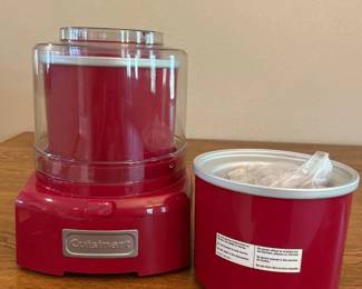 iz- This Cuisinart ice cream maker features a 1.5-quart capacity, perfect for homemade frozen desserts. It boasts a vibrant red color and compact design, measuring approximately 8 inches in height and width, making it a stylish and practical addition to any kitchen countertop. The machine includes a clear lid for easy monitoring and a durable mixing paddle for smooth, creamy results.