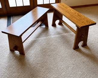 gh- This set features two Stickley Mission Thistle benches, showcasing beautiful craftsmanship with a mortise and tenon joint detail. The benches are constructed from high-quality wood with a warm, rich finish, highlighting the classic Mission style. The first bench measures 21" tall, 43" wide, and 12" deep, while the second bench measures 17" tall, 48" wide, and 13" deep. These sturdy benches provide timeless appeal and functional seating for any space.