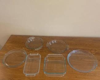 ka- This glass bakeware essentials set includes six versatile pieces perfect for baking, serving, and storing. Crafted from clear, durable glass, the set features a variety of shapes and sizes to accommodate different cooking needs. Dimensions include a rectangular dish approximately 13 inches by 7.5 inches with a depth of 2.75 inches, and a square dish roughly 9.75 inches by 9.75 inches. Each piece offers excellent heat resistance and easy cleaning, making this collection both practical and stylish for any kitchen.