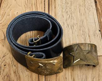 am- Lot includes a vintage Soviet-era adjustable military belt with brass-tone buckle, along with an additional loose Soviet military buckle. The belt buckle features a raised five-pointed star with hammer-and-sickle emblem positioned above an anchor, a design associated with Soviet naval military insignia. The black belt is adjustable and retains its metal adjustment hardware. The additional brass-tone buckle features a prominent raised Soviet star with hammer-and-sickle emblem. Both buckles exhibit natural age-related patina, oxidation, surface wear and scratches, adding to their vintage appearance. Belt shows expected wear from age and use. Please review photos for condition and details. An interesting pair of Cold War-era Soviet militaria for a military, USSR, naval or historical collection.