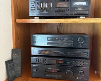 cm- This Pioneer audio system features a range of high-quality components, including a CT-WM 77R multi-cassette changer with auto reverse and Dolby HX Pro, the VSP-333 AV surround processing amplifier, the TX-1330Z FM/AM digital synthesizer tuner, a 5-band graphic equalizer and spectrum analyzer, and the SA-1530 stereo amplifier. All components are finished in classic black metal casing, offering robust build quality and a sleek aesthetic. The unit also includes a remote control as shown in the picture, enhancing user convenience. Perfect for audiophiles and collectors seeking a complete, high-performance vintage audio setup.
