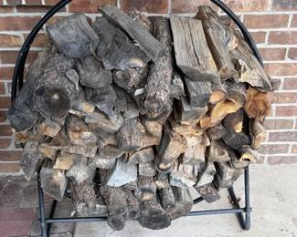 ic- This sturdy firewood rack features a curved metal frame designed to hold a generous amount of firewood. Measuring 53 inches in height and 44 inches in width, it is ideal for organizing and storing logs neatly. The rack comes with a full load of seasoned firewood, ready for use in your fireplace or wood stove. Its black metal construction ensures durability and stability, while the compact design suits both indoor and outdoor spaces, keeping your firewood accessible and dry.