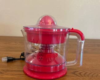jj- This Dash Electric Citrus Juicer offers a convenient and efficient way to extract juice from citrus fruits. Featuring a clear plastic pitcher with measurement markings, it allows you to see the juice level as you press. The juicer is compact in size, easy to handle with a sturdy handle and spout for easy pouring. Its vibrant red accents give it a modern and attractive look. The electric operation ensures quick and effortless juicing, making it perfect for any kitchen countertop.