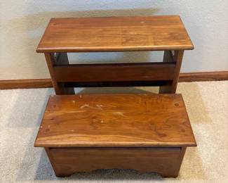 ha- This wooden step stool features a sturdy two-step design, perfect for reaching higher shelves or providing extra seating. Crafted from solid wood with a rich brown finish, it showcases natural wood grain patterns for an authentic rustic look. The stool measures 15.5 inches tall, 18 inches wide, and 16 inches deep, offering a compact yet functional size. Side handles are incorporated for easy carrying and repositioning, making it a practical addition to any home. Its durable construction ensures long-term use in kitchens, bedrooms, or workshops.