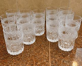 li- A collection of 14 Libby style old fashion tumblers featuring a radiant pattern highlighted by an intricate diamond cut design. This lot includes two sizes: 9 tumblers measuring 3.75 inches tall and 3 inches wide, and 7 tumblers measuring 4.25 inches tall and 2.75 inches wide. Made of clear glass, these tumblers showcase elegant faceted detailing perfect for both everyday use and special occasions.