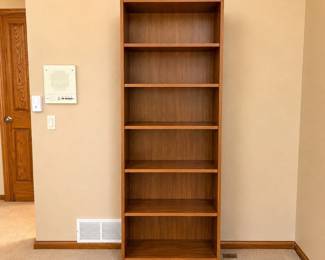 gz- This brown veneer bookcase combines practical storage with a sleek, minimalist design. Featuring a height of 78 inches, width of 24 inches, and depth of 12.5 inches, it fits comfortably in various room sizes. The rich brown veneer finish adds warmth and elegance to any space, while multiple shelves provide ample room for organizing books, documents, or decorative items. Its sturdy construction ensures durability and long-lasting use.