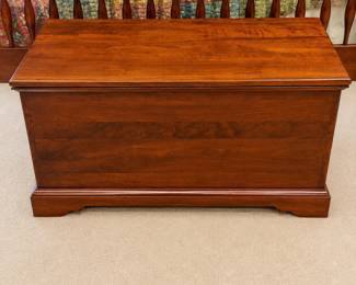 cu- This Lexington Quilt Chest #833-652 is a beautifully crafted wooden storage chest made in the U.S.A. It features a traditional design with sturdy construction and a warm wood finish, perfect for adding a touch of classic elegance to your home. The chest offers ample storage space, ideal for quilts, blankets, or other household items. Measuring 21 inches tall, 40 inches wide, and 19 inches deep, it fits conveniently in bedrooms, living rooms, or entryways. Its durable wood material ensures long-lasting functionality, while the hinged lid provides easy access to stored items.