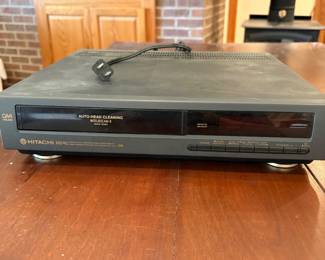 co- This Hitachi M240 DA 4-head VCR features digital auto tracking and multiple input/output options, including composite and coaxial connectors. It is a sturdy unit with a black exterior, designed for standard VHS cassette tapes. Please note, the cassette mechanism does not eject, which may require repair or parts replacement. Ideal for collectors or those needing a VCR for parts or restoration.
