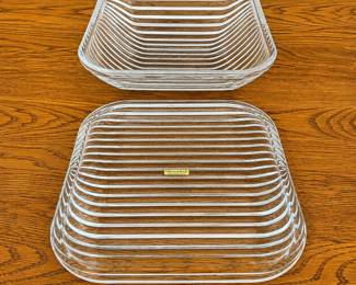 ey- This vintage Villeroy & Boch serving dish is crafted from 24% lead crystal, part of the prestigious Quadra Crystal Collection, made in 1990 in West Germany. The dish features a unique square shape with horizontal ribbed texture, enhancing its elegance and sophistication. Measuring approximately 12 inches in width, this clear crystal piece is both functional and decorative, ideal for special occasions or as a collector's item.