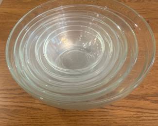 jv- This elegant set of 6 nesting glass bowls by Duralex is made in France, known for its high-quality tempered glass. The clear glass design allows for versatile use in any kitchen or dining setting. Each bowl varies in size, perfectly nesting for compact storage, ranging approximately from 2 inches in height to 7.5 inches in diameter. Durable and stylish, these bowls are ideal for serving, mixing, or storing food while adding a timeless glassware touch to your collection.