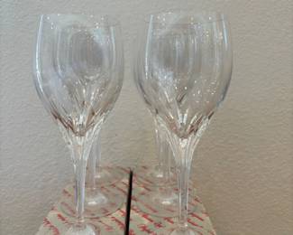 fo- This elegant set of six Nachtmann Bleikristall 'Turning Point' crystal wine glasses features a classic goblet shape with intricate faceted details that catch the light beautifully. Each glass measures 8 inches tall and is crafted from high-quality crystal, offering clarity and brilliance ideal for any fine dining or special occasion. The glasses come in their original Noritake branded packaging, ensuring authenticity and perfect condition for collectors or enthusiasts.