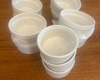 kc- This set includes 11 white ceramic soufflé dishes, perfect for baking and serving individual soufflés or other delicious desserts. Each dish features a classic fluted design and measures approximately 4.25 inches in diameter and 2.5 inches in height. Crafted from durable ceramic material, these dishes offer excellent heat resistance and even cooking. The clean white color adds an elegant touch to any dining table or kitchen setting. Ideal for both everyday use and special occasions.