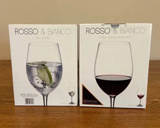 ix- This elegant set includes four Nachtmann Rosso & Bianco crystal wine glasses, crafted in Germany with high-quality crystal lead-free glass. The set features two types of glasses specifically designed to enhance your wine experience: Rosso for intense red wines and Bianco for delicate white wines. Each glass showcases a clear, sleek design with a long stem and a spacious bowl, perfect for highlighting the aromas and colors of your favorite wines. The exquisite craftsmanship and durable material make these glasses ideal for both everyday use and special occasions.