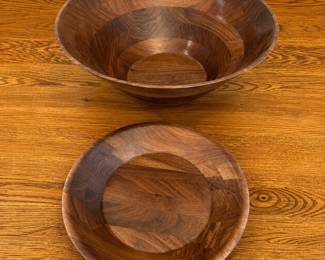 fe- Set of elegant and sturdy salad bowls crafted from rich walnut wood. These bowls feature a natural wood grain finish that enhances their warm brown tones and unique wood patterns. The larger bowl measures approximately 11.5 inches in diameter and about 5 inches in height, while the smaller bowl is around 12 inches in diameter with a shallow depth of 3 inches. Both bowls showcase the high-quality workmanship of Independent Stove Co., with a smooth, polished surface ideal for serving salads or decorative purposes.