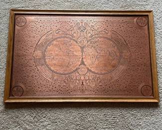 ej- Large decorative world map rendered on what is believed to be copper, featuring two hemispheres surrounded by exceptionally detailed classical figures, scrollwork, celestial imagery, decorative borders, and corner medallions. The intricate design appears etched and/or embossed into the metal, with darkened recessed areas creating strong contrast against the warm copper surface. Presented in a wood frame with hanging wire on the reverse. No maker’s mark or label is visible in the photographs. Believed to be copper; metal content has not been tested or independently verified. Shows light age-appropriate wear and patina. Please see photos for details and condition.