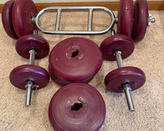 ij- This DP Fit For Life Weight set offers a versatile 110 lbs total weight capacity, perfect for a range of strength training exercises. The set features maroon-colored weight plates made from durable materials, each plate marked with precise weight indicators. Includes two grip bars with secure star lock collars to keep weights firmly in place. The compact and adjustable design allows easy customization to suit beginners through advanced users, making it a practical addition to any home gym.