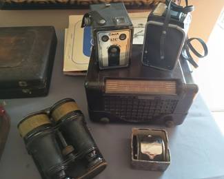 Old cameras, binoculars and radios