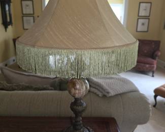  vintage Raymond Waites for Tyndale table lamp features an ornate cast-metal base with an integrated marble or onyx orb accent and a textured gold-fringed shade