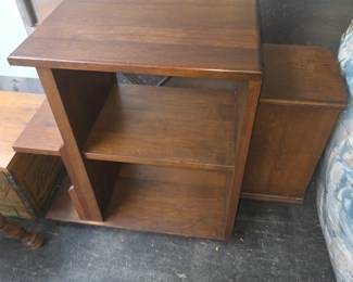 vintage wooden end table or side table featuring an asymmetrical tiered shelf design and built-in side compartments for storage.