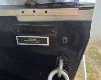 Back of boat, near motor. Right side
