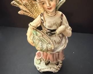 Vintage Porcelain Figurine of a Girl with Harvest Basket