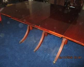 Matching Duncan Pfyfe dining room table (shown with 3 leaves) and comes with 6 chairs and padds. The table with leaves measure 9' and 4"