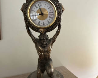 Lot 75: Atlas Titan Bronze clock held aloft by muscular statue