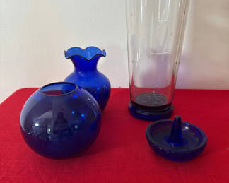 Lot 65: Blue Glass Vases and Tall Etched Hurricane pilsner goass