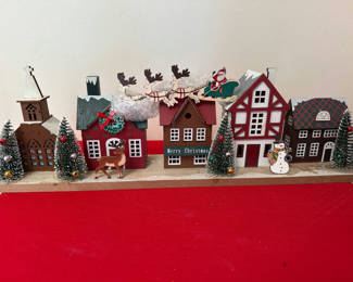 Lot 37: New in box - Christmas village with houses, trees, and holiday figures