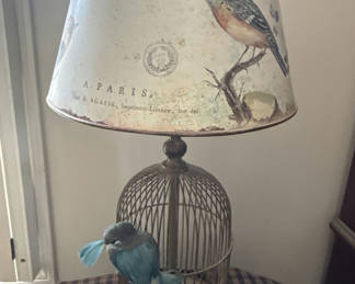 Lot 112: Birdcage-style table lamp with printed shade and blue decorative birds