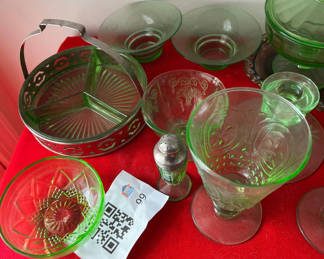 Lot 99: Green glassware collection with lidded dish and metal basket